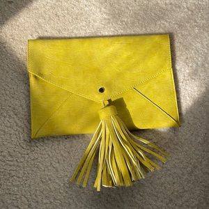 Envelope clutch with tassel.